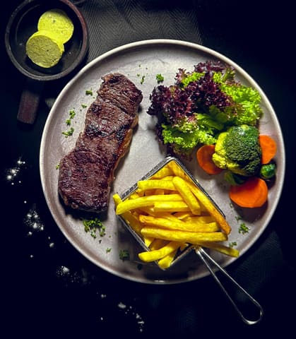 House-marinated beef entrecôte, a signature dish at Restaurant Lindenblüte